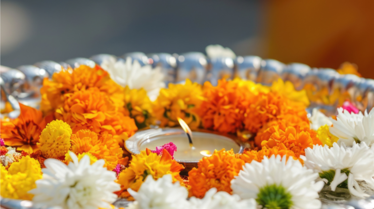 Thali filled with flowers and a diya for pooja
