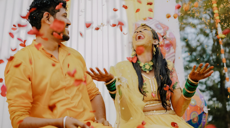 Indian couple celebrating wedding ceremony with flower shower during shubh vivah muhurat 2026 as per Hindu Panchang