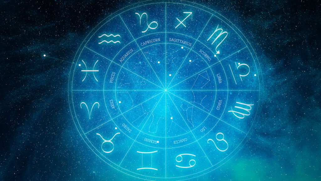 Zodiac wheel with all 12 astrological signs against a starry blue cosmic background representing Monthly horoscope May 2026