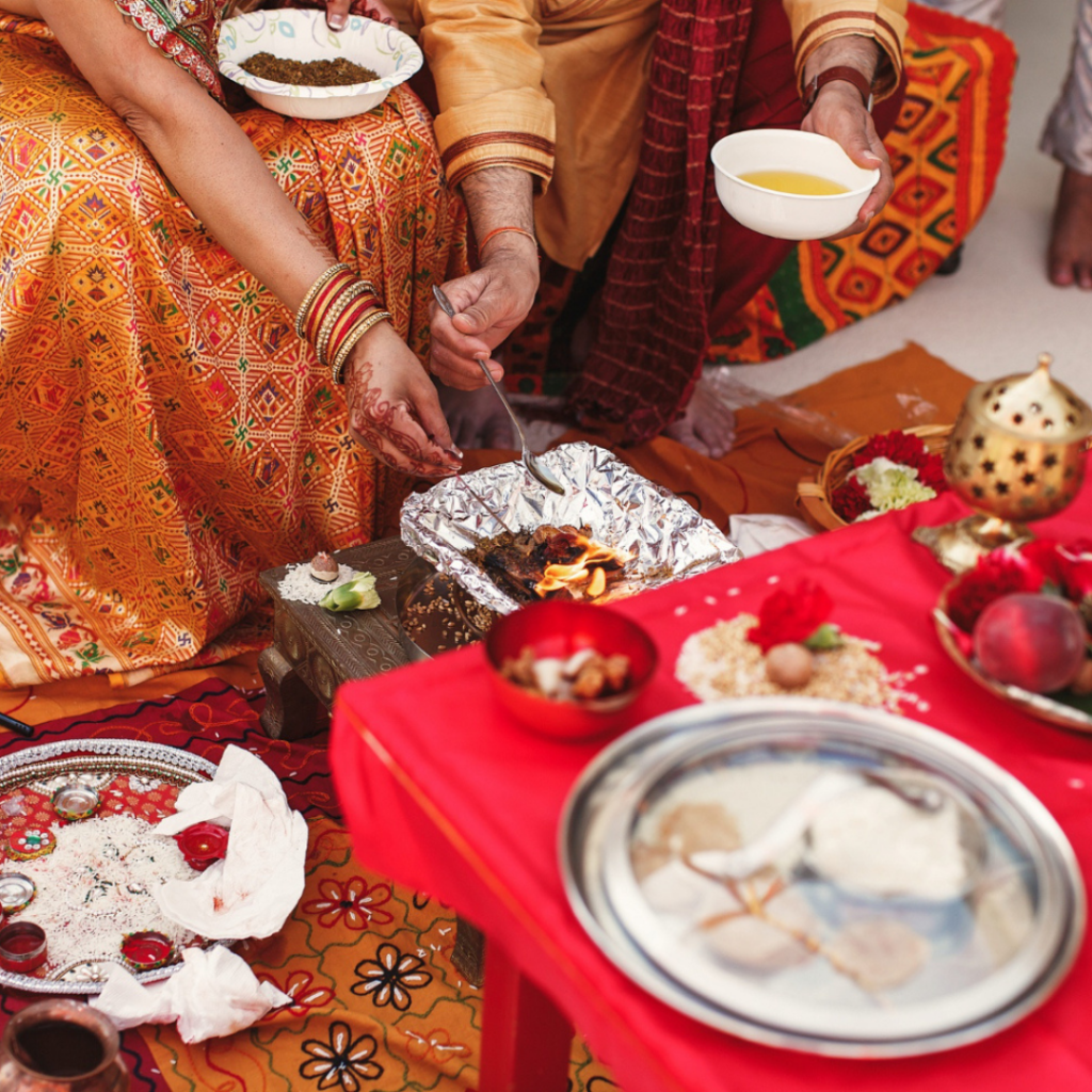 Devotees performing Lord Shiva puja and evening rituals during Guru Pradosh Vrat in a temple